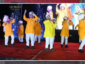Colorful stage decoration and performances at the Annual Day event of Holyhearts Public School, Attabira.